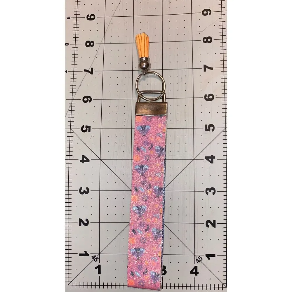☀️3/$9☀️ Glitter Butterfly and Flower Faux Leather Keychain with Orange Tassel